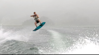 a man up in the air wakeboarding on lake arenal
 - Costa Rica