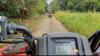 atv nosara tour guide going in front on a dirt trail
 - Costa Rica