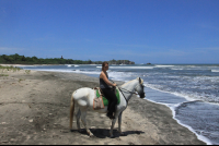 riding horseback side
 - Costa Rica