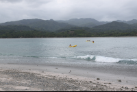 distant kayaks chora island 
 - Costa Rica