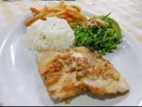 fish filet with salad rice and french fries at perla del sur restaurant 
 - Costa Rica