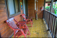 Two Queen Bed Cabanas Front Corridor With Chairs And Hammock Blue River Resort
 - Costa Rica